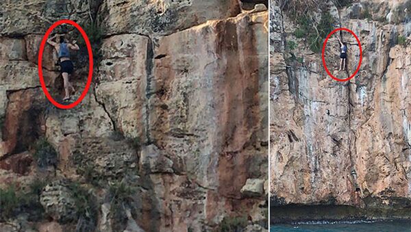 Köpeğini kurtarmak isterken indiği 30 metrelik falezlerde mahsur kaldı - Sputnik Türkiye