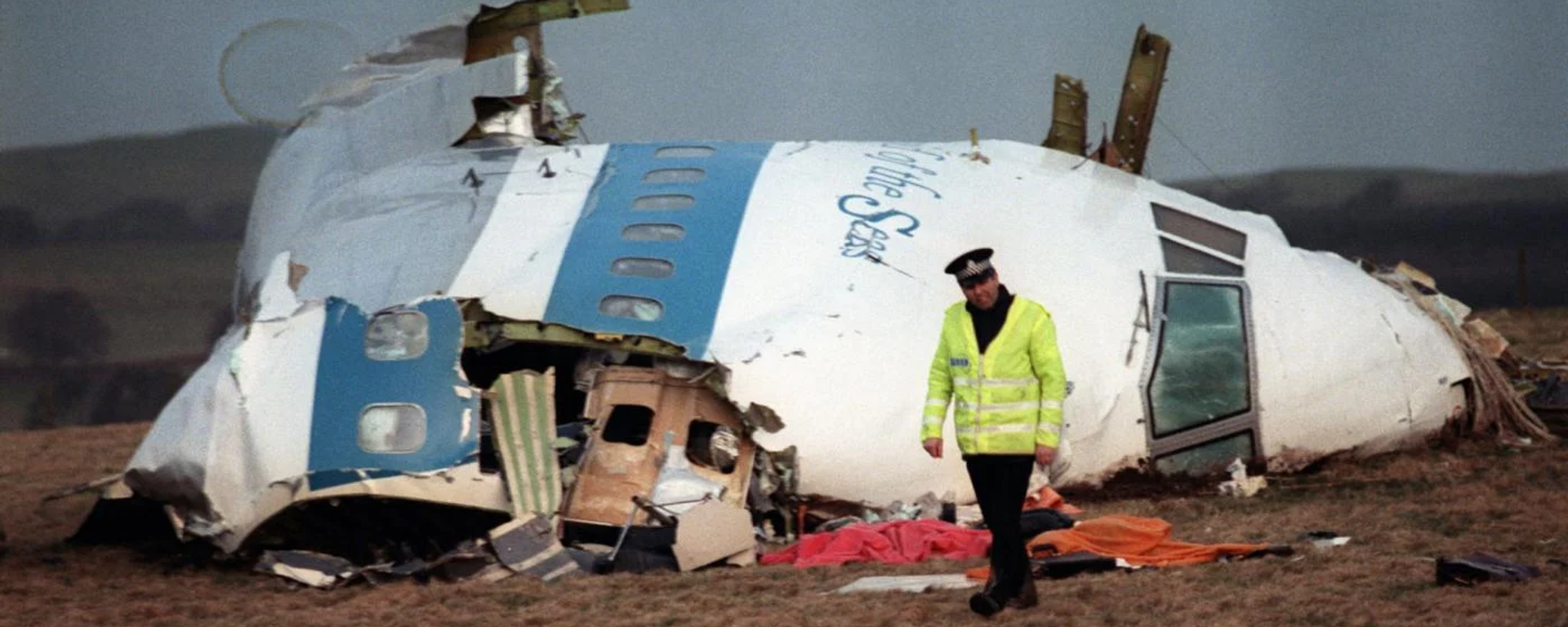 İskoç yetkililer, 34 yıl önce Lockerbie kasabası üzerinde Pan Am 103 sefer sayılı uçağın infilakına neden olan bombayı yapmakla suçlanan Libyalı Ebu Agila Muhammed Mesut'un ABD'de gözaltına alındığını duyurdu. - Sputnik Türkiye, 1920, 13.12.2022