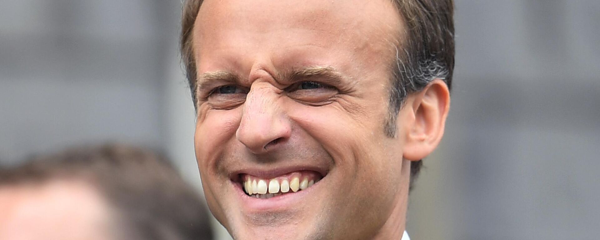 French President Emmanuel Macron grimaces on the town hall balcony on occasion of the Charlemagne Prize awarding in Aachen, Germany, Thursday, May 10, 2018 - Sputnik Türkiye, 1920, 02.05.2024