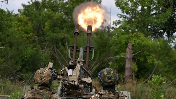 Военнослужащие подразделения противовоздушной обороны группировки Центр работают по БПЛА из зенитной установки ЗУ-23 на боевых позициях на Авдеевском направлении СВО - Sputnik Türkiye