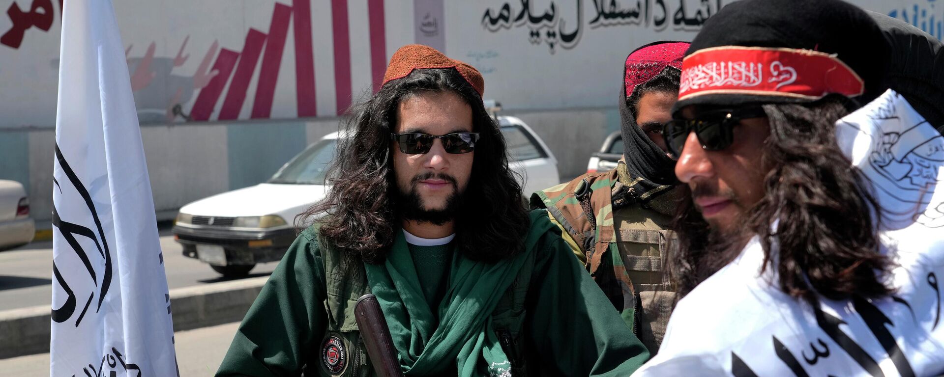 Taliban fighters celebrate the first anniversary of the withdrawal of US-led troops from Afghanistan, in front of the U.S. Embassy in Kabul, Afghanistan, Wednesday, Aug. 31, 2022 - Sputnik Türkiye, 1920, 14.08.2024