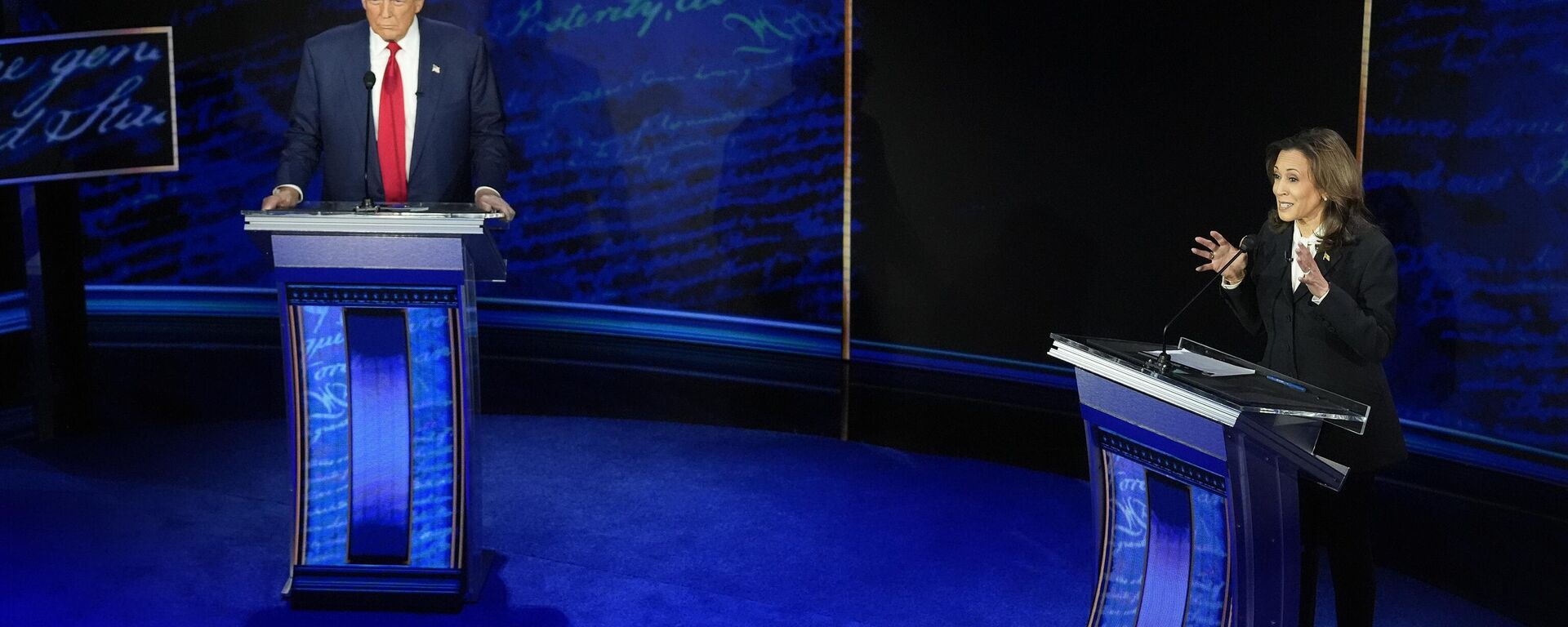 Republican presidential nominee former President Donald Trump watches as Democratic presidential nominee Vice President Kamala Harris speaks during an ABC News presidential debate at the National Constitution Center, Tuesday, Sept. 10, 2024, in Philadelphia.  - Sputnik Türkiye, 1920, 11.09.2024