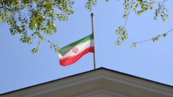 A national flag is lowered to half mast at the Iranian embassy - Sputnik Türkiye