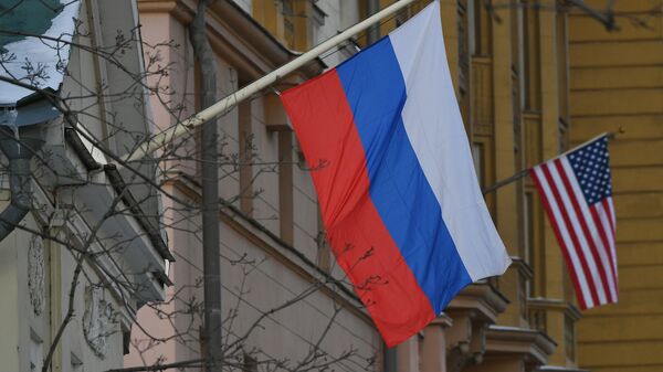 The national flags of Russia and the USA are seen on the building of the US Embassy in Novinsky Boulevard in central Moscow, Russia. - Sputnik Türkiye