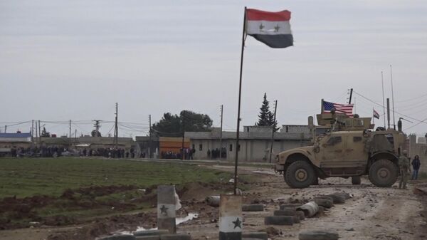 In this frame grab from video, an American military convoy is seen in the village of Khirbet Ammu, east of Qamishli city, Syria, Wednesday, Feb. 12, 2020. - Sputnik Türkiye