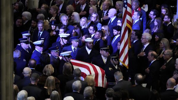 The flag-draped casket of former President Jimmy Carter arrives for a state funeral at Washington National Cathedral in Washington, Thursday, Jan. 9, 2025. (AP Photo/Ben Curtis) - Sputnik Türkiye