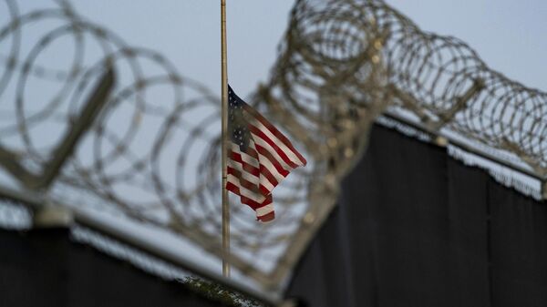 US flag flies at half-staff as seen from Camp Justice in Guantanamo Bay Naval Base, Cuba, Aug. 29, 2021. - Sputnik Türkiye