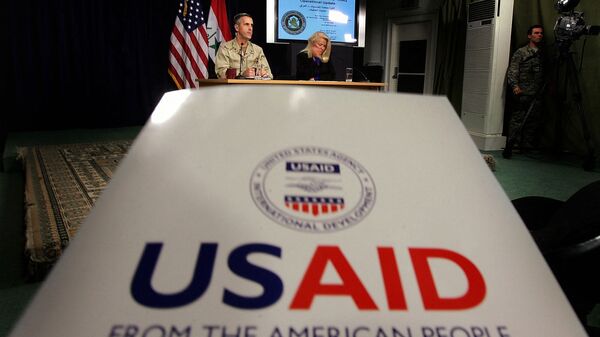 Denise Herbol (C-R), deputy director of the United States Agency for International Development – Iraq (USAID), and Rear Adm. Gregory Smith (L), director of the Multi-National Force-Iraq's Communications Division hold a joint press conference at the heavily fortified Green Zone area in Baghdad, 13 January 2008 - Sputnik Türkiye