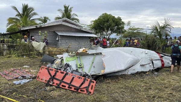 Wreckage of airplane in a rice field in Maguindanao del Sur province, Philippines, after officials say a U.S. military-contracted plane has crashed in a rice field in the southern Philippines, killing all four people on board, on Thursday Feb. 6, 2025. (Sam Mala/UGC via AP) - Sputnik Türkiye