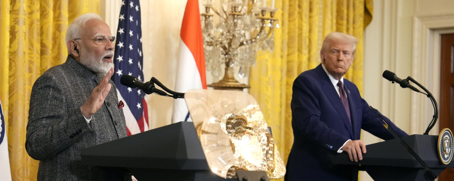 India's Prime Minister Narendra Modi speaks as President Donald Trump listens during a news conference in the East Room of the White House, Thursday, Feb. 13, 2025, in Washington. - Sputnik Türkiye, 1920, 14.02.2025