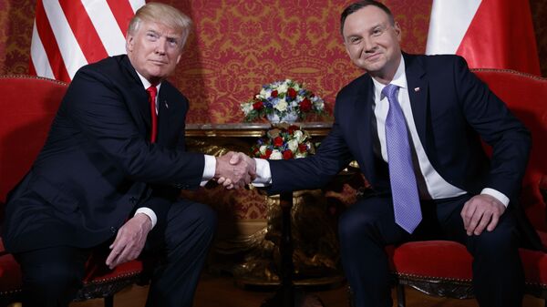 U.S. President Donald Trump, left, and Polish President Andrzej Duda pose for photographers as they shake hands during their meeting at the Royal Castle, Thursday, July 6, 2017, in Warsaw - Sputnik Türkiye