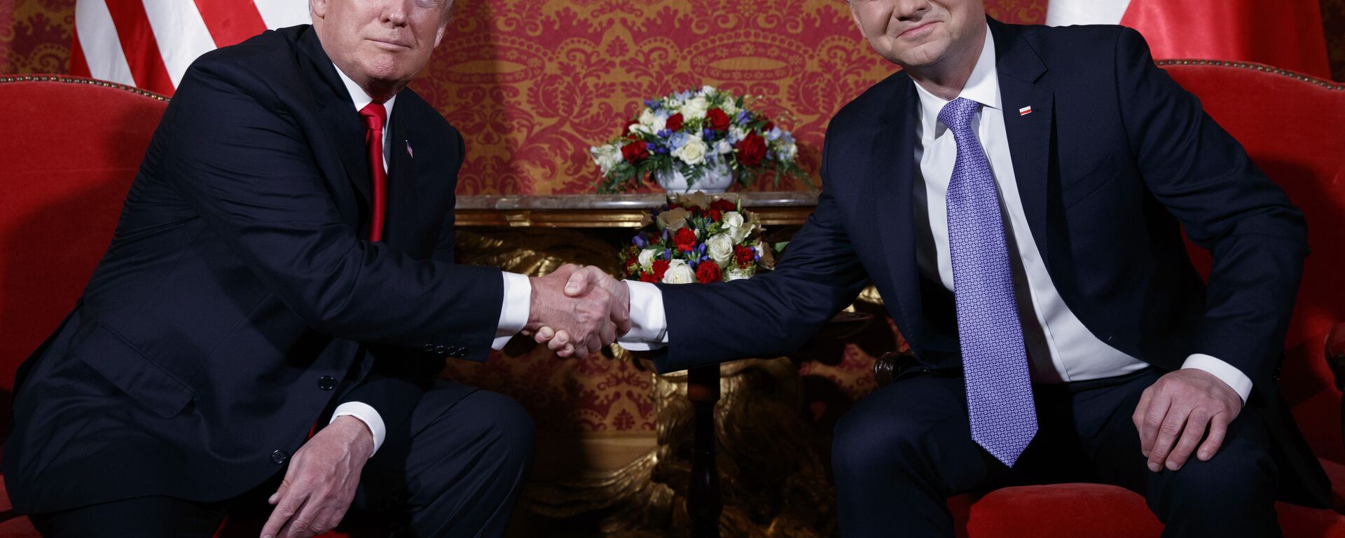 U.S. President Donald Trump, left, and Polish President Andrzej Duda pose for photographers as they shake hands during their meeting at the Royal Castle, Thursday, July 6, 2017, in Warsaw - Sputnik Türkiye, 1920, 13.03.2025