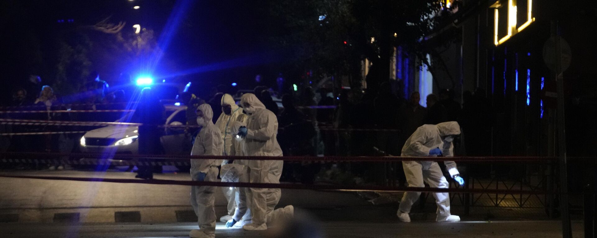 Police officers from the forensics department check the area after a bomb explosion outside of the Hellenic Train offices the company that runs Greece's railway, in Athens, Greece, Friday, April 11, 2025. - Sputnik Türkiye, 1920, 12.04.2025