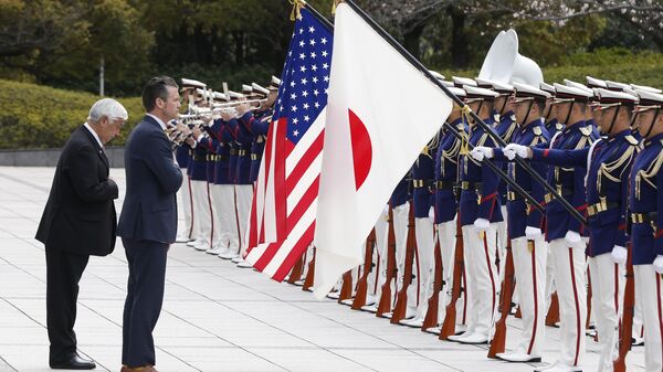 Japan's Defense Minister Gen Nakatani, left, and US Defense Secretary Pete Hegseth review an honor guard during a welcome ceremony at the Ministry of Defense in Tokyo Sunday, March 30, 2025. - Sputnik Türkiye