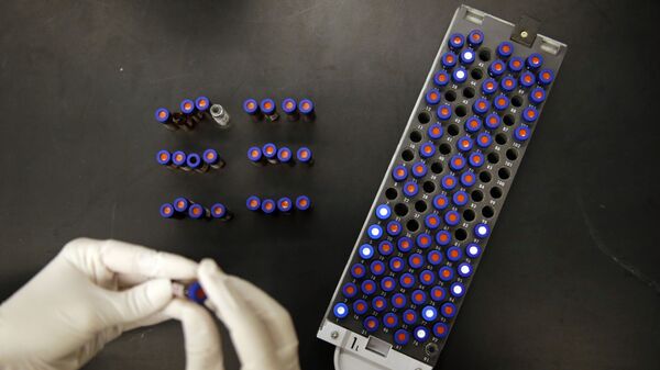 In this Aug. 10, 2015, photo, Christine Jelinek, a postdoctoral fellow at Johns Hopkins University, works alongside a tray of vials containing cerebral spinal fluid in Baltimore. Dr. Akhilesh Pandey, a researcher at Johns Hopkins University, said his research analyzes both adult and fetal tissue, and by identifying which proteins are present, he can get clues that could be used to help detect cancer in adults earlier. - Sputnik Türkiye