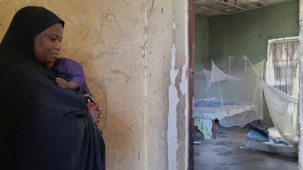 Amina Hassan, wife of the vice principal of the Government Girls Comprehensive Secondary School, where gunmen attacked the school dormitory, abducted schoolgirls and killed her husband - Sputnik Türkiye