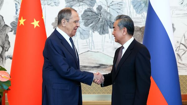 Russian Foreign Minister Sergey Lavrov and Chinese Foreign Minister Wang Yi - Sputnik Türkiye