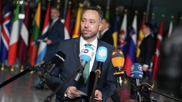 Belgium's Foreign Minister Maxime Prevot speaks with the media as he arrives for a meeting of NATO foreign ministers at NATO headquarters in Brussels - Sputnik Türkiye