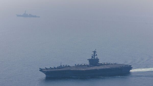 ABD Merkez Kuvvetler Komutanlığı (CENTCOM), Umman Denizi'nde seyir gerçekleştiren Abraham Lincoln Uçak Gemisi Taarruz Grubu'nun fotoğraflarını paylaştı. - Sputnik Türkiye