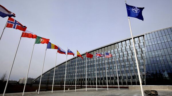 Flags of Alliance members flap in the wind outside NATO headquarters in Brussels, Friday, Feb. 28, 2020.  - Sputnik Türkiye