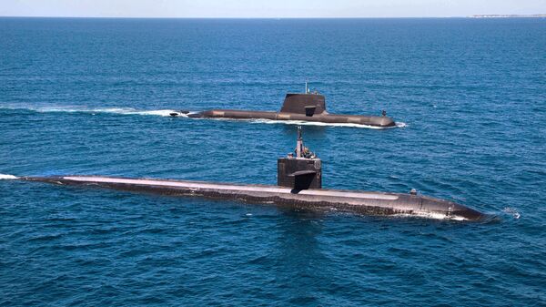 The U.S. Navy's Los Angeles-class fast attack submarine USS Albuquerque (SSN 706) and Royal Australian Navy Collins-class submarine HMAS Rankin (SSG 78) operate together in waters off Rottnest Island, Western Australia.  - Sputnik Türkiye