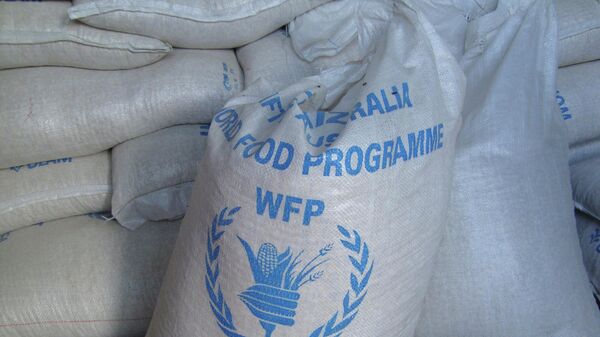 In this photo of Monday, Aug. 8, 2011 sacks of World Food Program, WFP, food is seen on a truck before being dropped off for storage in warehouses in the former Somali water agency that runs the biggest sell off of food aid in Mogadishu. - Sputnik Türkiye