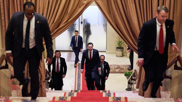 U.S. Vice President JD Vance, center, walks up a flight of stairs to meet with Pakistan's Prime Minister Shehbaz Sharif, Saturday, April 11, 2026, in Islamabad, for talks about Iran. - Sputnik Türkiye