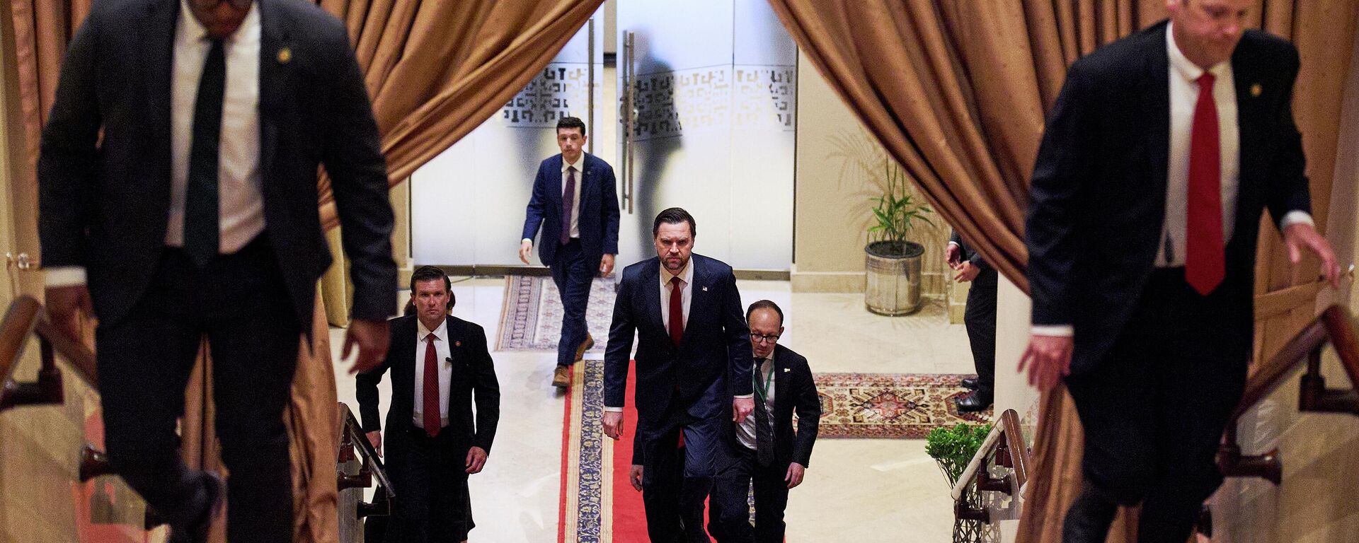 U.S. Vice President JD Vance, center, walks up a flight of stairs to meet with Pakistan's Prime Minister Shehbaz Sharif, Saturday, April 11, 2026, in Islamabad, for talks about Iran. - Sputnik Türkiye, 1920, 12.04.2026