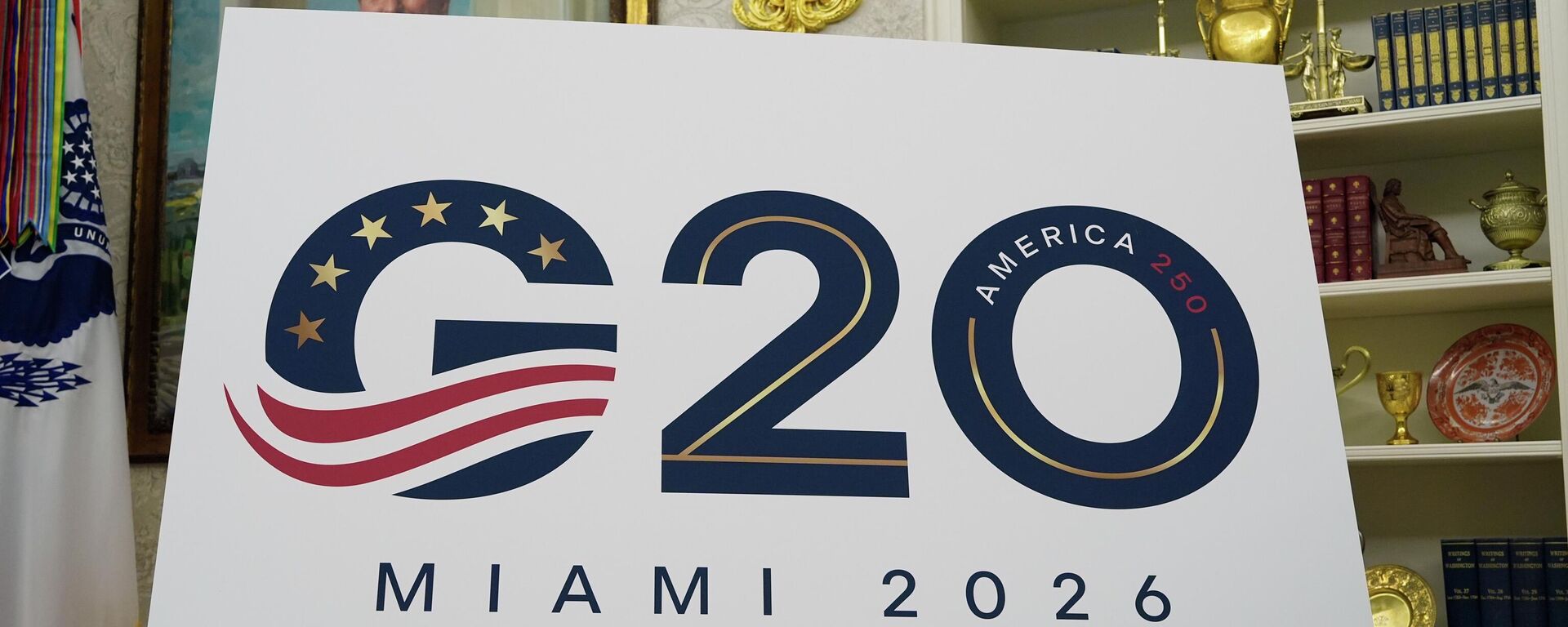 A sign for the G20 to be hosted in Miami in 2026 is displayed as President Donald Trump speaks in the Oval Office of the White House, Friday, Sept. 5, 2025, in Washington. - Sputnik Türkiye, 1920, 23.04.2026