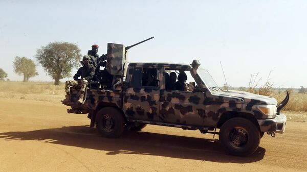 Nigerian soldiers drive past Government Science secondary school in Kankara , Nigeria, Wednesday, Dec. 16, 2020 - Sputnik Türkiye