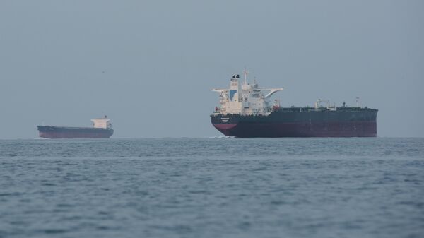 Tankers anchored in the Strait of Hormuz off the coast of Qeshm Island, Iran, April 18, 2026.  - Sputnik Türkiye