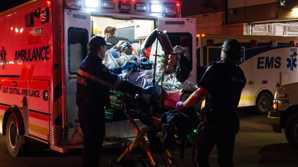 Paramedics load an injured person into an ambulance at the Wainwright Health Centre after a fire at Canadian Forces Base Wainwright, outside of Wainwright in Alberta, Canada. Photograph: John Ulan/The Canadian Press/AP - Sputnik Türkiye
