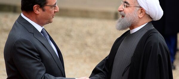 İran Cumhurbaşkanı Hasan Ruhani, Paris’te Fransız mevkidaşı François Hollande ile bir araya geldi. - Sputnik Türkiye