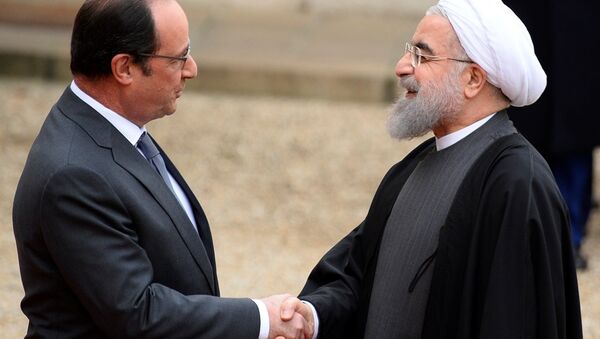 İran Cumhurbaşkanı Hasan Ruhani, Paris’te Fransız mevkidaşı François Hollande ile bir araya geldi. - Sputnik Türkiye