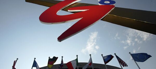 National flags of the G8 countries and the flag of the European Union fly near a logo of the G-8 summit in St. Petersburg, Thursday, July 13, 2006 - Sputnik Türkiye