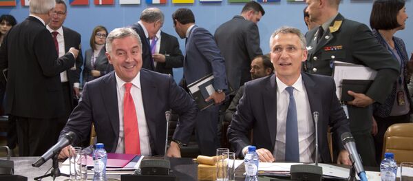NATO Secretary General Jens Stoltenberg, right, and Montenegro's Prime Minister Milo Dukanovic, left, take their seats during a meeting of the North Atlantic Council and Montenegro at NATO headquarters in Brussels on Thursday, May 19, 2016 - Sputnik Türkiye