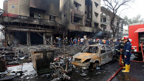 Bağdat'ın merkezindeki Karada mahallesinde bombalı araçla saldırı gerçekleştirildi. - Sputnik Türkiye