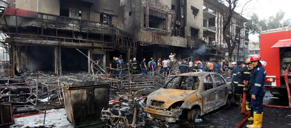 Bağdat'ın merkezindeki Karada mahallesinde bombalı araçla saldırı gerçekleştirildi. - Sputnik Türkiye