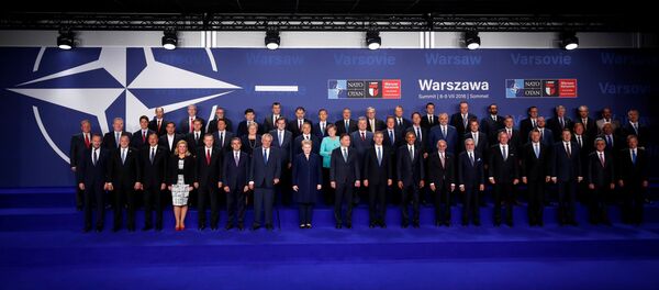 NATO heads of state and other leaders participate in a family photo at the NATO Summit in Warsaw, Poland July 8, 2016. - Sputnik Türkiye