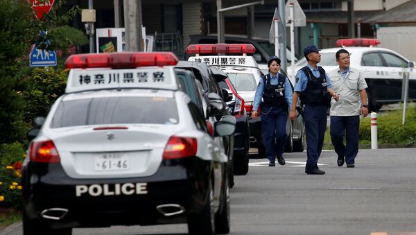 Police officers investigate near a facility for the disabled, where a deadly attack by a knife-wielding man took place, in Sagamihara, Kanagawa prefecture, Japan, July 26, 2016. - Sputnik Türkiye
