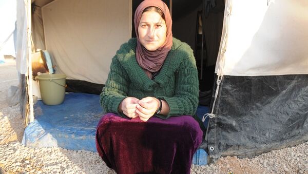 Ezidi kadın Roza Muhamed, Şengal’ı çok özlediğini belirterek, Halen yüzlerce insanımız ve akrabamız IŞİD’in elinde dedi. - Sputnik Türkiye