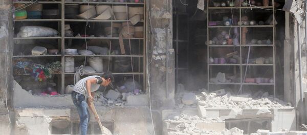 Suriye'nin Halep kentinin El Katerji mahallesine düzenlenen saldırının neden olduğu yıkım Suriye'nin Halep kentinin El Katerji mahallesine düzenlenen saldırının neden olduğu yıkım - Sputnik Türkiye