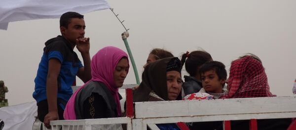 Musul'dan yoğun göç dalgası devam ediyor - Sputnik Türkiye