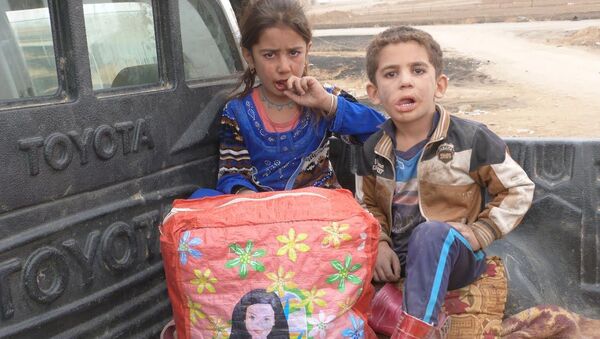 Musul'da evleri koasliyon uçakları tarafından bombalanan Esma ve Yusuf kardeşler - Sputnik Türkiye