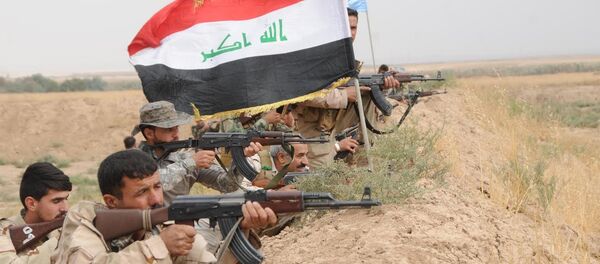 Musul'da IŞİD'e karşı savaşan Haşdi Şabi milisleri Musul'da IŞİD'e karşı savaşan Haşdi Şabi milisleri - Sputnik Türkiye