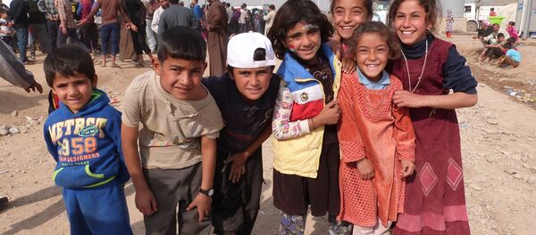 Musul'daki savaştan kaçan çocuklar - Sputnik Türkiye