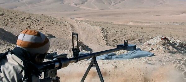 This image posted online on Saturday, Dec. 10, 2016, by Daesh supporters on an anonymous photo sharing website, purports to show a gunman firing at an unseen target, north of Palmyra in Homs Provence, Syria - Sputnik Türkiye