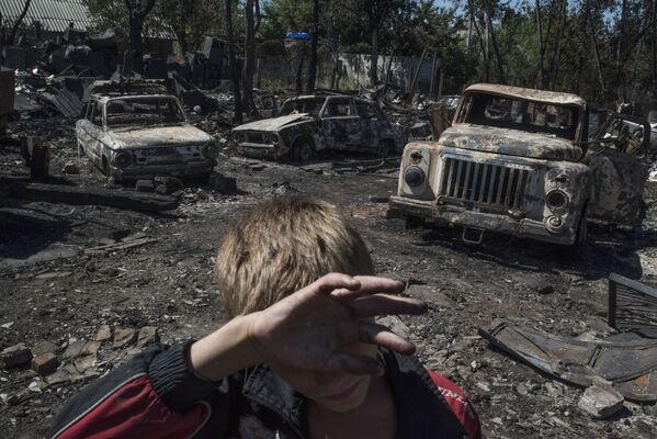 Donetsk bölgesinin Lozovoye kasabasına düzenlenen saldırının sonuçları. - Sputnik Türkiye