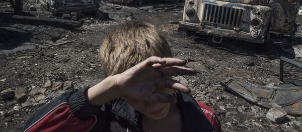 Donetsk bölgesinin Lozovoye kasabasına düzenlenen saldırının sonuçları. - Sputnik Türkiye