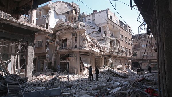 Kabun mahallesinde bombardıman sonucu yıkılan bir bina - Sputnik Türkiye